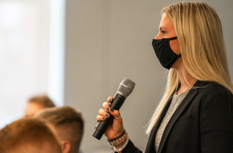 Image of woman speaking to group