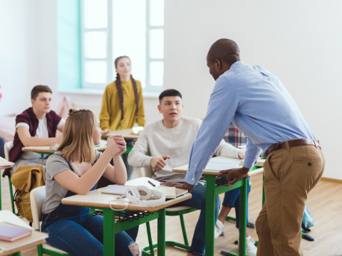 Image of teacher talking to students